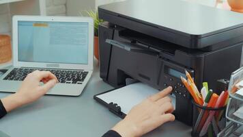 How to set up a multifunction printer with a laptop at home office for easy printing and scanning tasks video