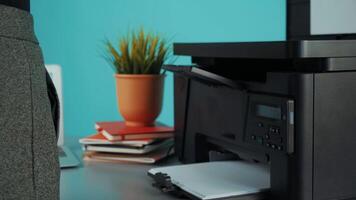 Working from home with a printer in a cozy office space featuring plants and organized notebooks video