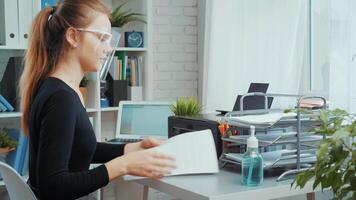 Organizing an efficient home office workspace in a bright, modern room with a focus on productivity and comfort video