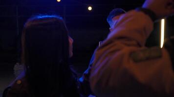 Celebrating under the stars with friends at an outdoor gathering in the evening video