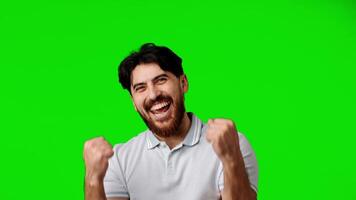 Excitement shown by man with beard celebrating in front of green background video