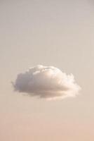 A single cloud floating in the sky photo