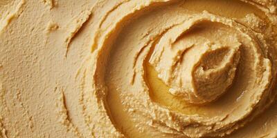 Close-up of hummus in a wide bowl with a smooth, undisturbed surface, food photography photo