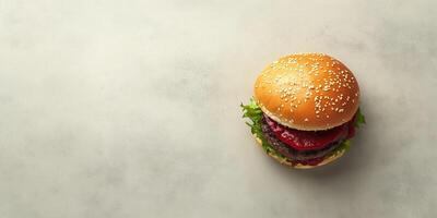 Burger with patty and fillings on a simple surface, culinary photography photo