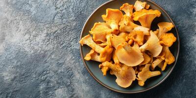 Chanterelle mushrooms placed in a small pile on a serving platter, culinary photography photo