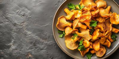 Chanterelle mushrooms placed in a small pile on a serving platter, gastronomy photography photo