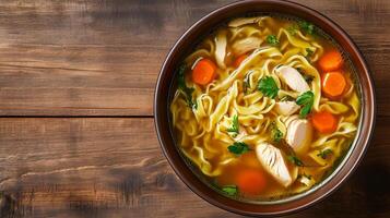 Chicken noodle soup in a dish with visible chicken, noodles, and vegetables, photorealistic food photo