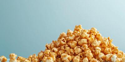 Caramel corn piled high, with coated popcorn arranged on a plain background, food setting photo