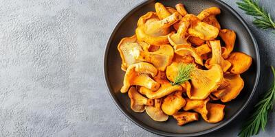 Chanterelle mushrooms placed in a small pile on a serving platter, meal photography photo