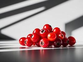 A cluster of bright red berries captured in a tight frame. photo