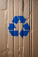 recycling symbol on a crumbled cardboard. photo