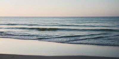 Tranquil beach with waves gently lapping at the shore. photo