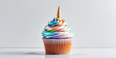 Enchanting unicorn themed cupcake with colorful iridescent frosting and shimmering edible glitter creating a whimsical magical treat for any or dessert lover. photo