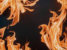 abstract orange yellow flames on black background dynamic fire texture. photo