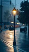 Lone streetlamp glowing warmly in rainy setting with shimmering droplets Vertical Mobile Wallpaper photo