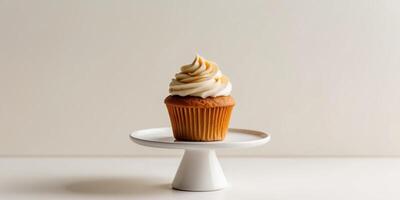 Autumn pumpkin spice cupcakes with cream topping on cake stand. photo
