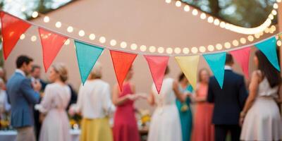 Colorful bunting is swaying in the breeze as string lights illuminate a festive backyard gathering. photo
