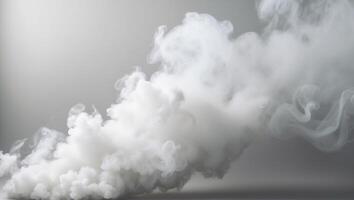 billowing white smoke on light gray background thick misty appearance vertical format. photo