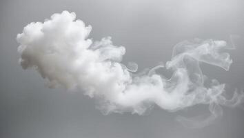 billowing white smoke on light gray background thick misty appearance vertical format. photo