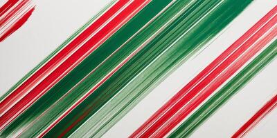 Festive red and green diagonal stripes background with abstract brush stroke texture for holiday design projects. photo