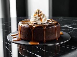A chocolate cake with whipped cream and caramel drizzle sits on a black marble surface. photo