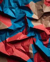 abstract red blue and brown crumpled paper background. photo
