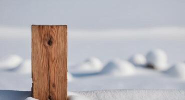 Rustic wooden plank with snow background. photo