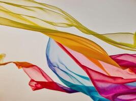 Abstract colorful fabric flowing in wind soft and delicate. photo