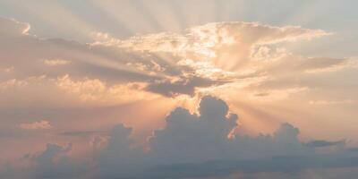 Stunning Sunrise Over Fluffy Clouds with Rays of Light Illuminating the Sky in a Gorgeous Display of Colors and Textures. photo