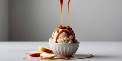 Caramel apple ice cream with apple slices and caramel drizzle. photo