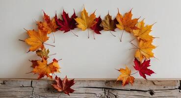 Autumn Leaves Frame a Weathered Wooden Surface. photo
