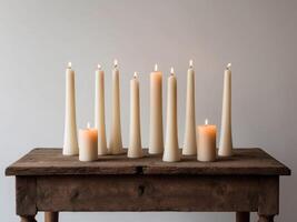Group of Candles Arranged on a Decorative Surface. photo