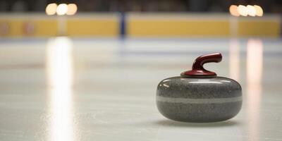 Curling Stone on Ice with Blurred Arena Lights. photo