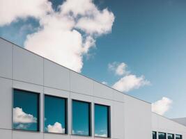 office building with adorable glass windows and with beautiful sky. photo