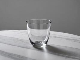 Elegant Glass Water Cup on a Marble Table. photo