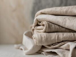 Folded rustic linen textures in neutral tones for background. photo