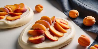 Delicious peach slices on creamy dessert with fresh apricots on dark linen background. photo