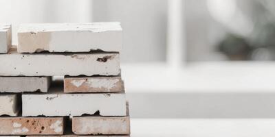 Stacked bricks in neutral tones showcasing texture and wear. photo