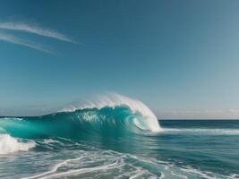 Turquoise ocean wave crashing in serene blue sea under clear sky creating a refreshing coastal scene. photo