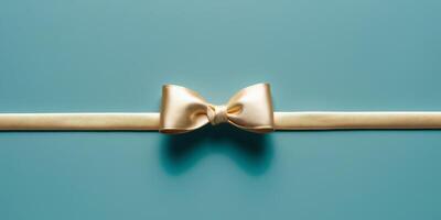 A golden bow on a bright blue background. photo