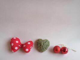 Christmas gifts and decorations on a minimalist pastel pink background. photo