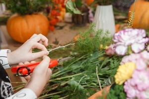 Creating a floral composition in a pumpkin. Making decor with your own hands. photo