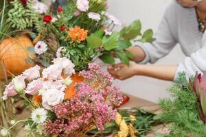 Creating a floral composition in a pumpkin. Making decor with your own hands. photo