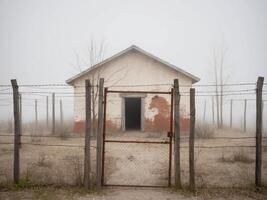 An old abandoned building in the fog photo