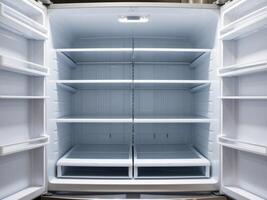 An empty refrigerator with its doors open photo