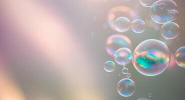 Soap bubbles floating in the air on a gray background photo
