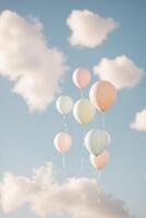 Pastel balloons floating in the sky photo