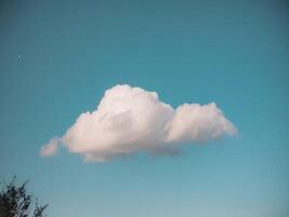 A white cloud is floating in the sky photo