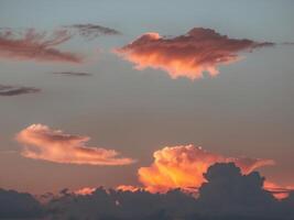 A sunset with clouds in the sky photo