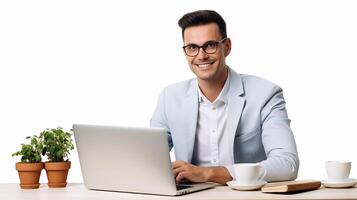 A man in glasses is sitting at a desk with a laptop photo